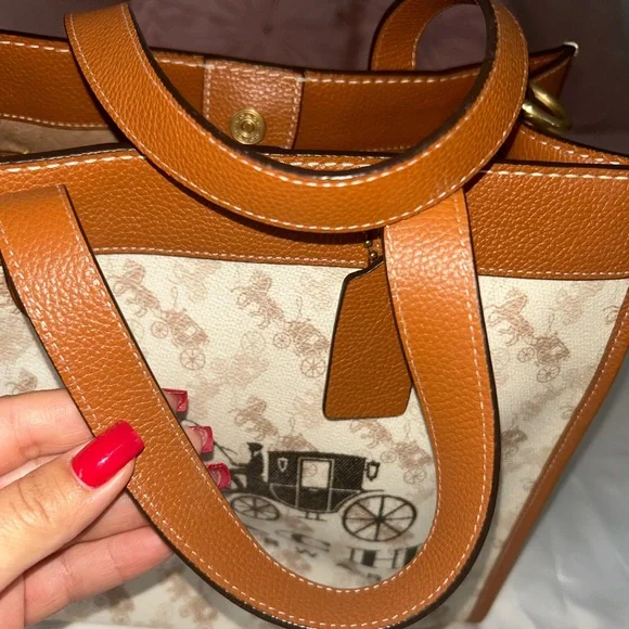 Coach Brown and Cream Tote Bag that is the sun that is casting spots on the bag - Picture 5 of 7